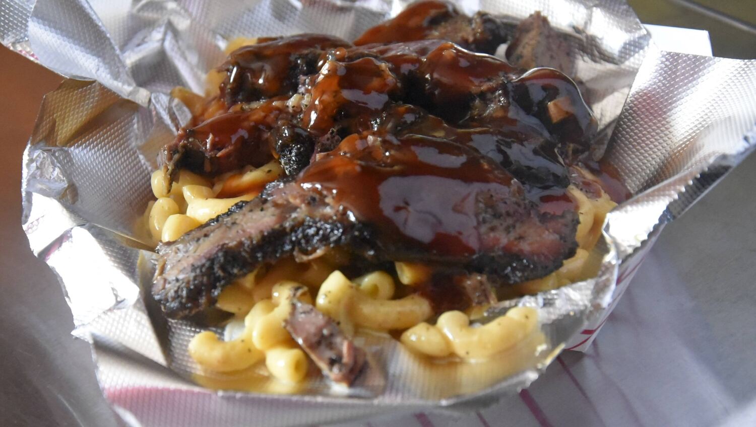 Slap Yo Self BBQ brisket mac and cheese — smoked brisket over creamy mac in Marion, Ohio