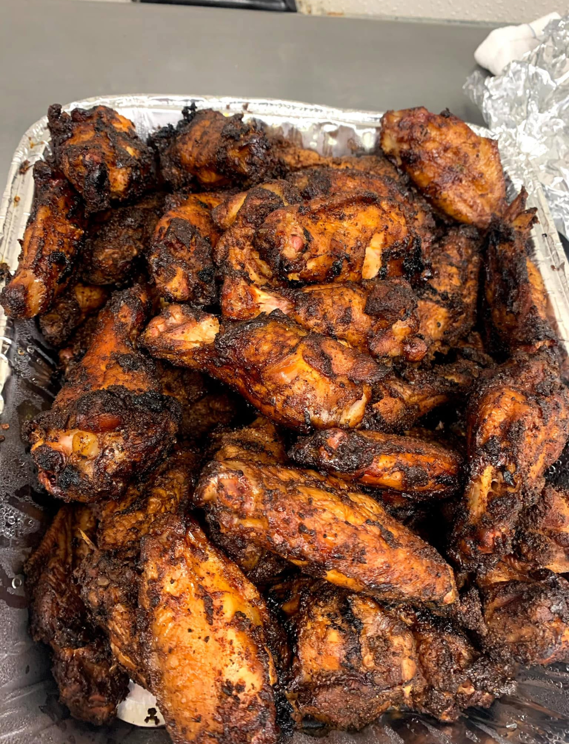 Honey barbecue smoked wings — dry-rubbed and slow-smoked crispy chicken wings with smoky honey BBQ seasoning at Slap Yo Self BBQ in Marion, Ohio